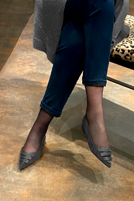 Dark grey women's open arch dress pumps. Pointed toe. Flat flare heels. Worn view - Florence KOOIJMAN
